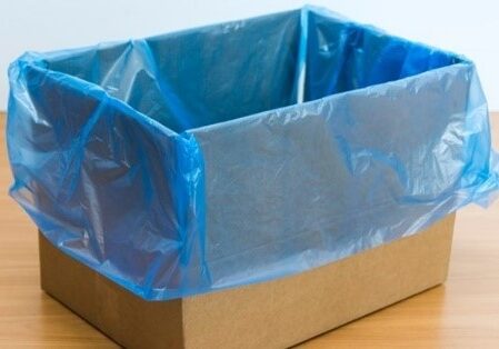 A box with blue plastic on top of it.